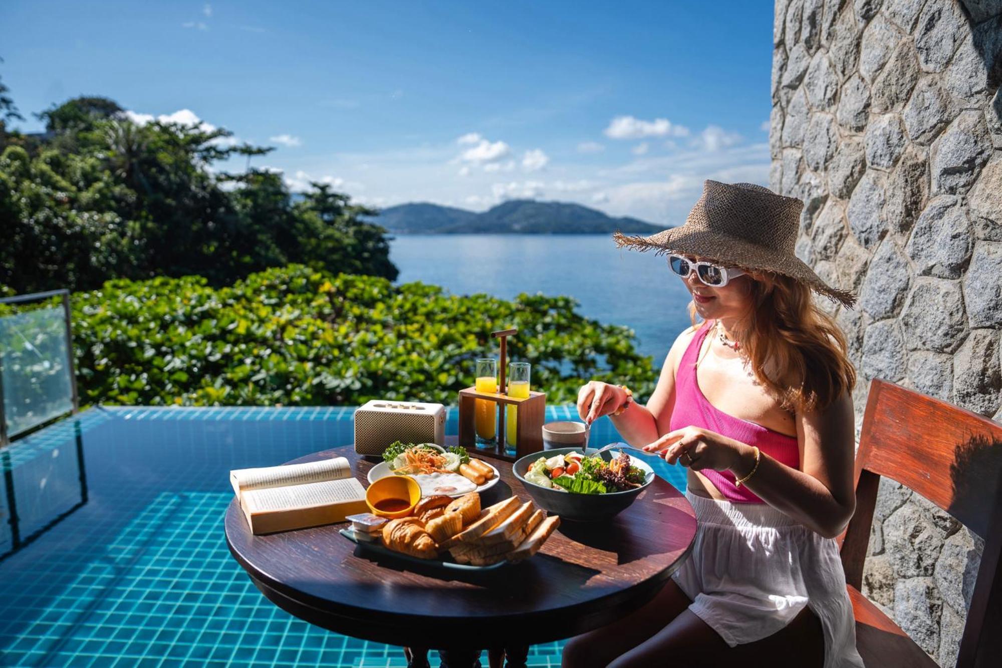 Zenmaya Oceanfront Phuket, Trademark Collection By Wyndham Patong Bagian luar foto A woman eating breakfast at a resort